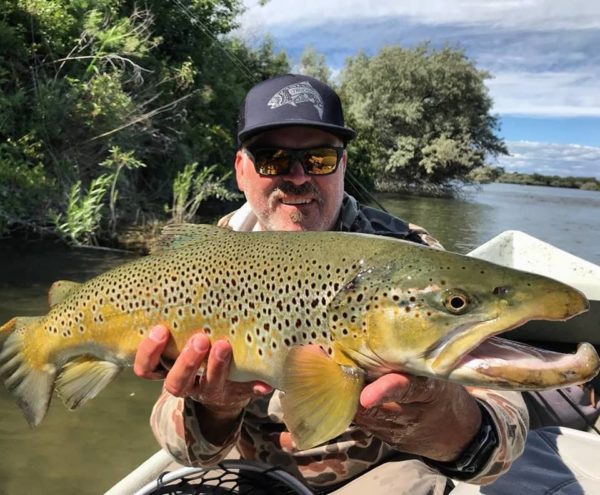 Guide Tim Smith with big brown trout